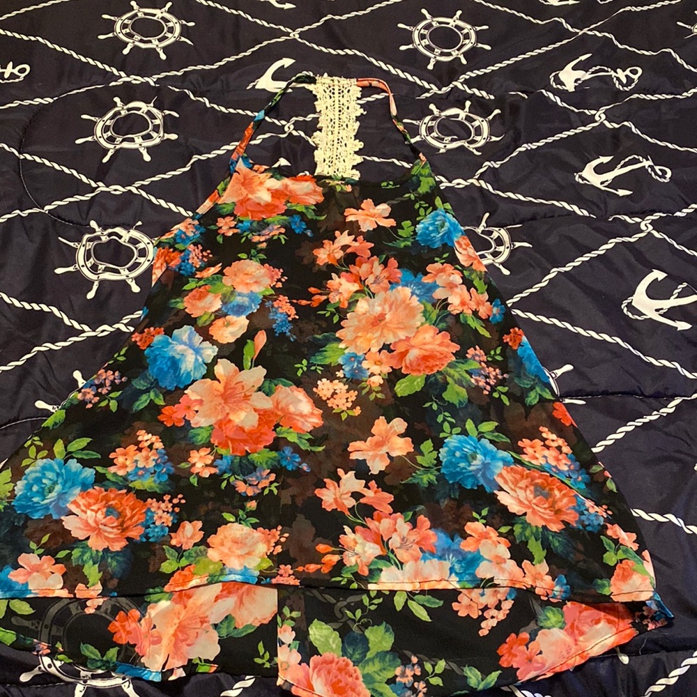 Boutique sheer floral tank with lace back.